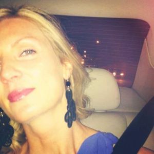 Alison, Scottish beauty wearing De' Mel S shape black Venetian lace earrings with black swarovski crystal and silver hardware