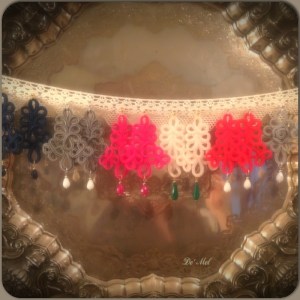 Italian ornamental cord collection in various colors (left to right) royal night blue,pearl gray, bright pink, sand white,passion red and light gray with various semi- precious stones