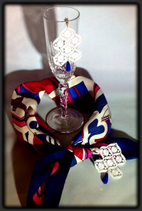 White Venetian lace earrings with opaque Safire and gold hardware here with Hermes foulard and Tiffany tableware