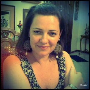 Rosele wearing Etoupe Full-moon Venetian lace earrings with white agate and silver hardware